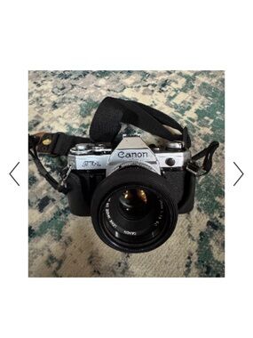 Canon AE-1 Film Camera in Silver and Black with Lens